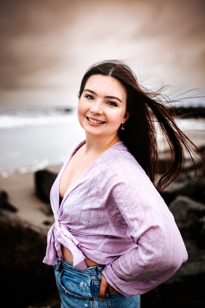 Senior photo at Folly Beach SC near Morris Island Light House by Neha Kotecha Photoraphy.