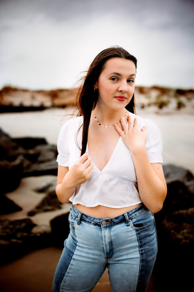 Senior photo at Folly Beach SC near Morris Island Light House by Neha Kotecha Photoraphy.