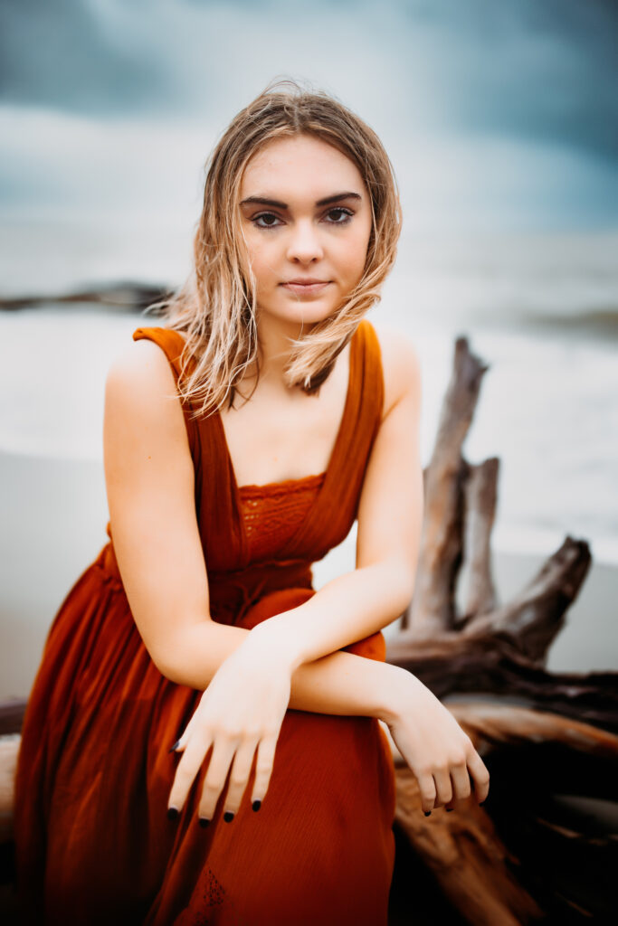 Senior photo at Folly Beach SC near Morris Island Light House by Neha Kotecha Photoraphy.