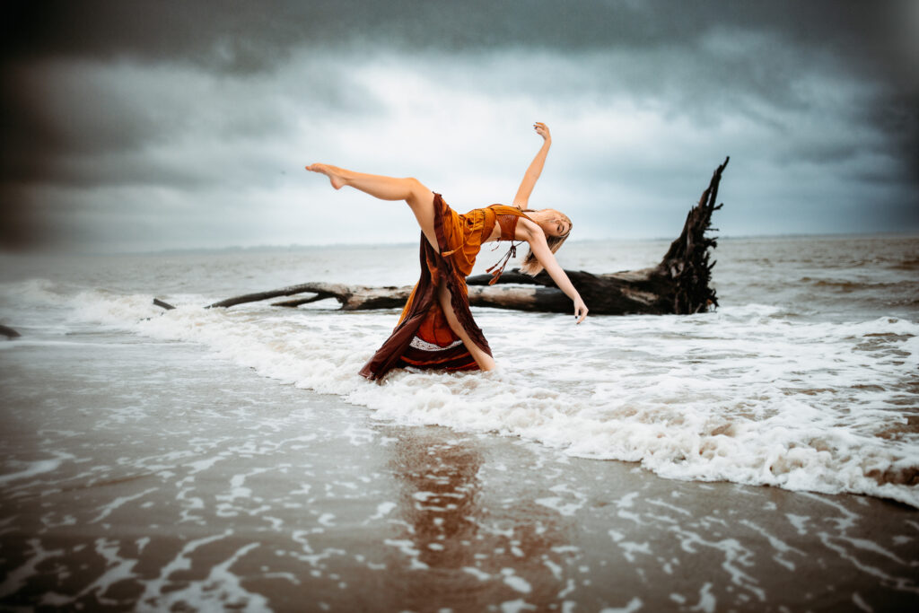 Senior photo at Folly Beach SC near Morris Island Light House by Neha Kotecha Photoraphy.