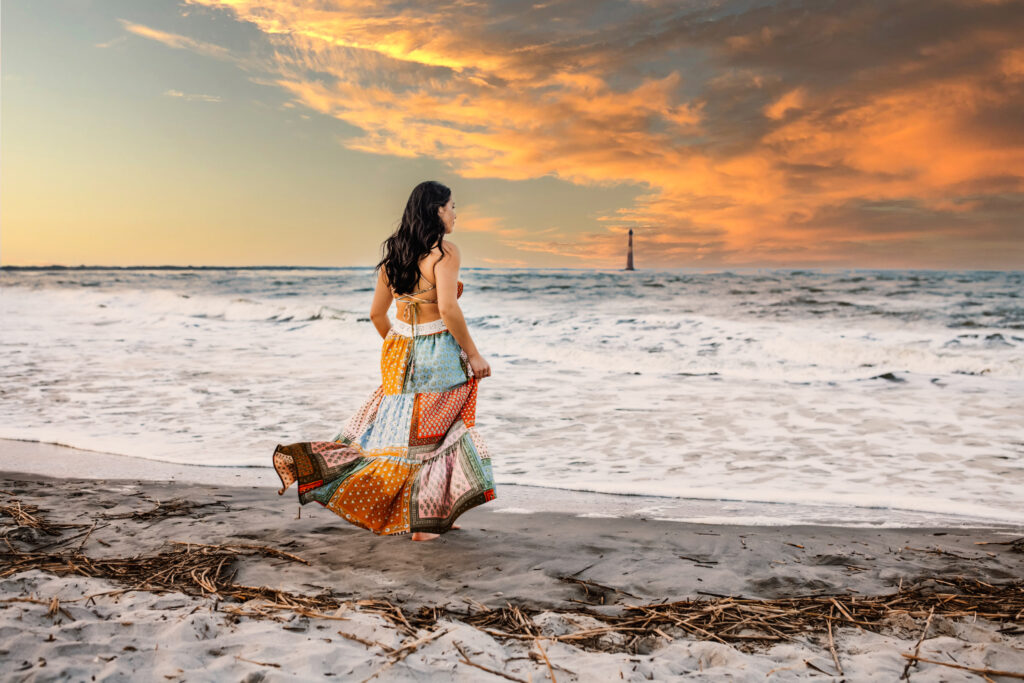 Senior photo at Folly Beach SC near Morris Island Light House by Neha Kotecha Photoraphy.