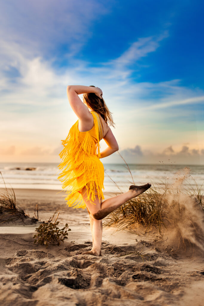 Senior photo at Folly Beach SC near Morris Island Light House by Neha Kotecha Photoraphy.