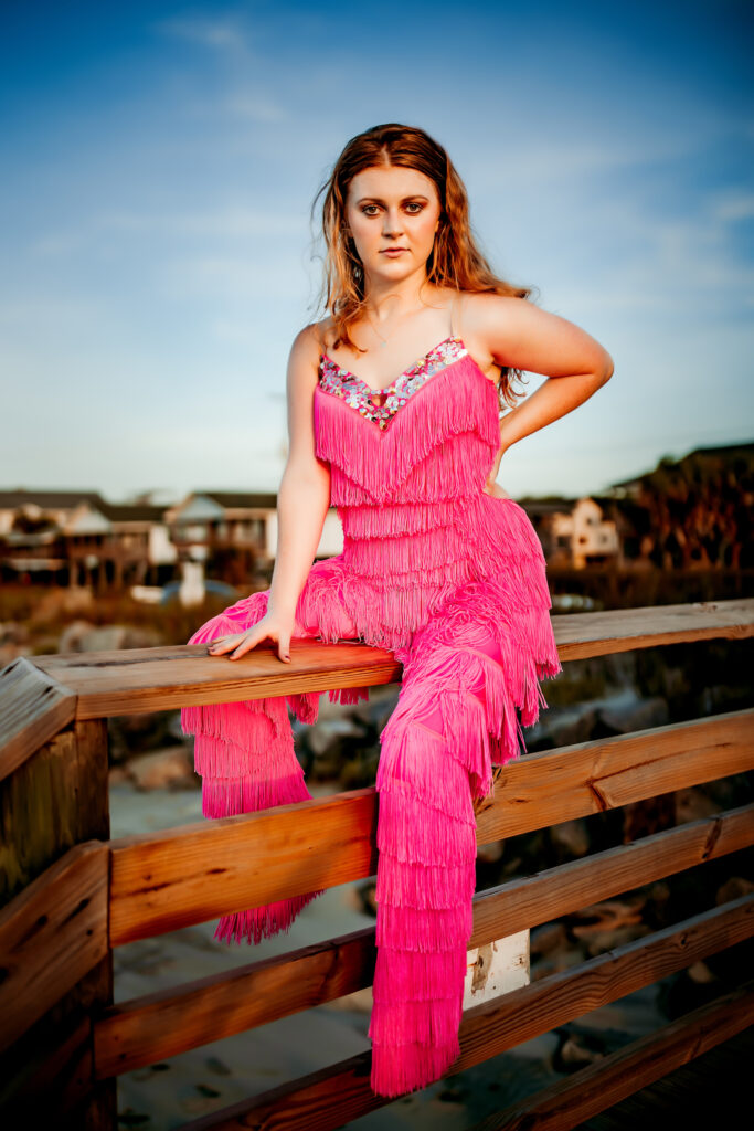 Senior photo at Folly Beach SC near Morris Island Light House by Neha Kotecha Photoraphy.